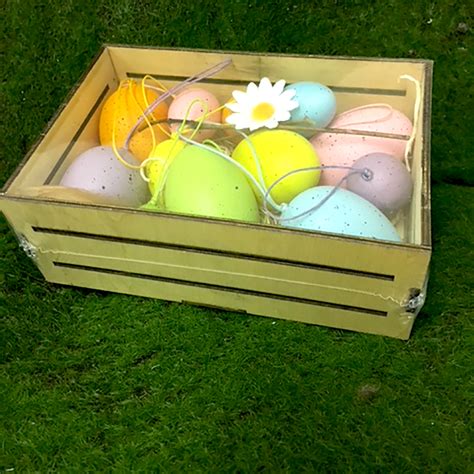 easter eggs crate with coloured plastic eggs shelf edge