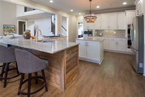 The overlay is usually grooved or has a decorative edge, designed to look like the cabinet door is carved from one plank of wood. Home | Kitchen and bath remodeling, White granite countertops, Raised panel cabinets