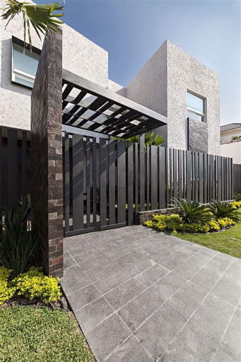 Steel main gate design for home: Exquisite-Modern-House-Design-with-Black-Entrance-Gate ...