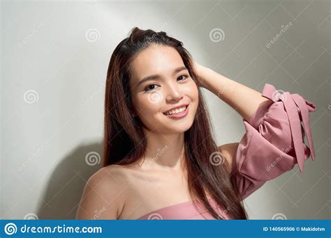 Spectacular Asian Young Woman Playing With Her Hair Indoor Photo Of