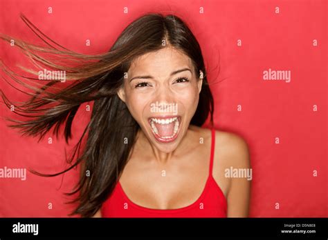 Portrait Of Mixed Race Asian Caucasian Brunette Young Woman Screaming