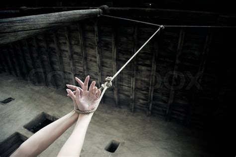 woman hands hanged on the rope in stock image colourbox