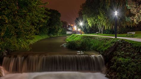 Landscape Photo Of Waterfall River During Nighttime With Street Light