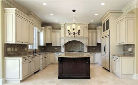 Kitchen With Antique White Cabinets And Dark Brown Center Island With