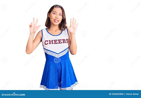 Young Beautiful Chinese Girl Wearing Cheerleader Uniform Showing And