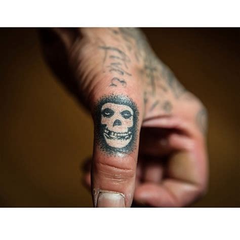 Travis barker on the plane crash with dj am: Travis Barker tattoo | Misfits skull tattoo, Finger tattoos