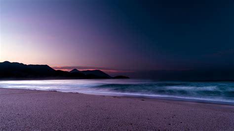 Download Calm Beach Purple Sunset 2560x1440 Wallpaper Dual Wide 16