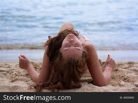 A Pretty Woman In Bikini Sunbathing At The Beach Free Stock Images Photos