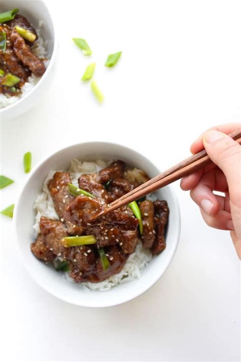 Paleo Mongolian Beef In A Bowl Topped With Spring Onions And Chop
