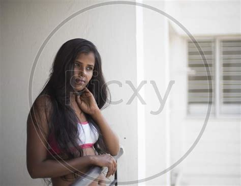 Image Of Portrait Of An Attractive Young Brunette Dark Skinned Indian Bengali Girl In Western