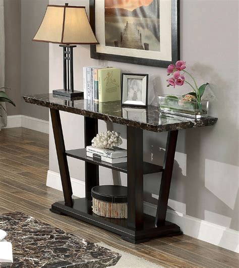 The base features a bottom shelf, allowing you to store away your favorite décor or coffee table books. CM4933S Clayton dark walnut finish wood faux marble top sofa table | AMB Furniture