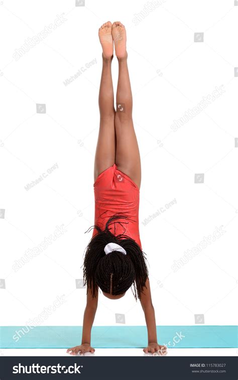 Young Girl Doing Gymnastics Handstand Stock Photo
