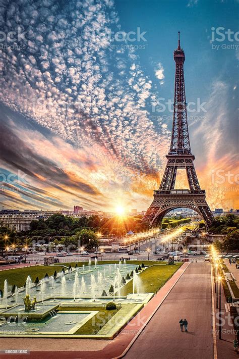 It is an iron lattice tower situated in champ de mars, paris, france. Paris France Sunset By Eiffel Tower Stock Photo - Download ...