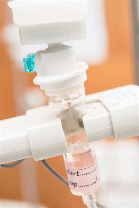 Close Up Saline Iv Drip For Patient And Infusion Pump In Hospital Stock