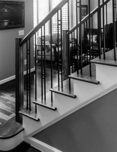 This modern stair railing highlights unconventional lines to show off a trendy chic style. Modern Railing Design | Artistic Stairs