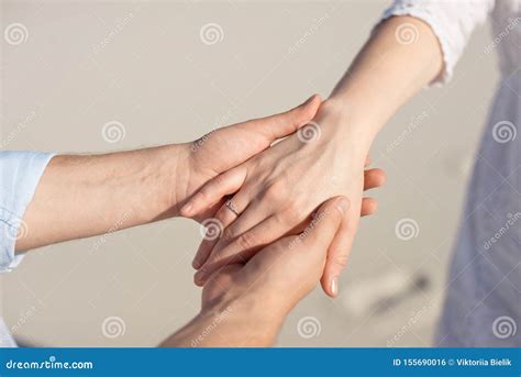 Close Up Man And Woman Hand Touching Holding Together On Blurred