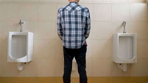 Queue Building In Gents Loo After Man Chooses To Use The Middle Of