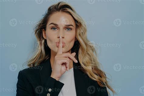 Blonde Woman Making Shush Gesture With Her Hand 8241289 Stock Photo At