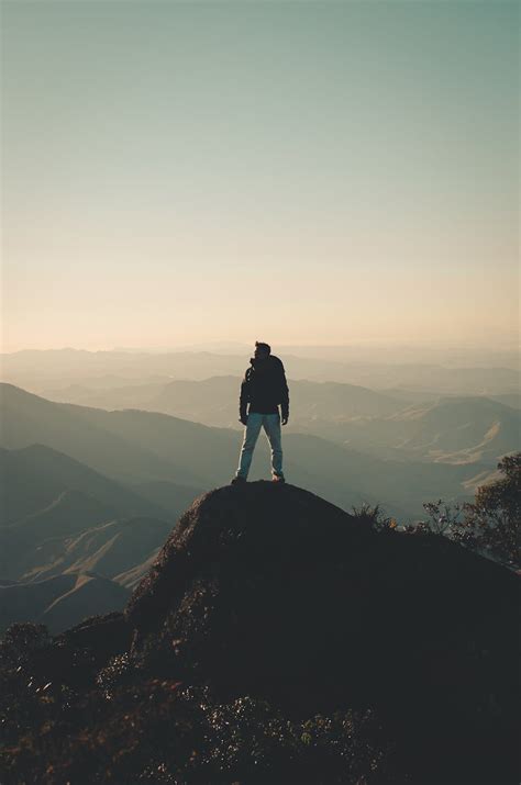 Photo Of Man Standing On Hill · Free Stock Photo