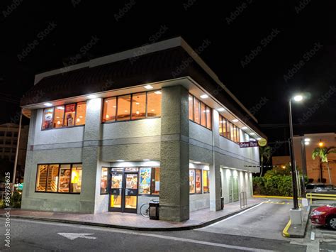 Two Story Mcdonalds Store At Night With Drive Thru And Entrance Stock