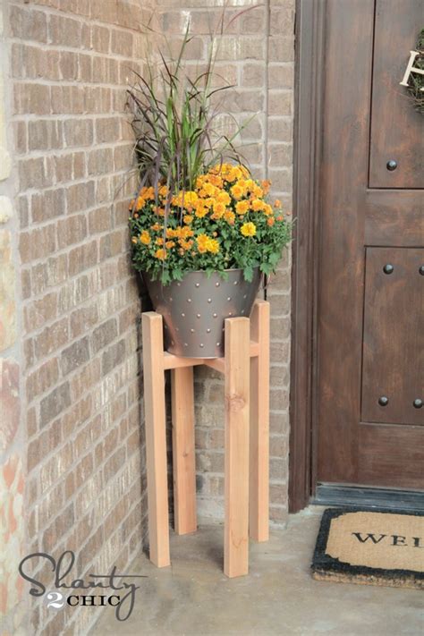She may still need to put together a whole living room, a few finishing touches on her bedroom, get a washer & dryer, (she can cross that gorgeous kitchen off the list now!) but plants, plenty of those! FREE Woodworking Plans - DIY Plant Stand