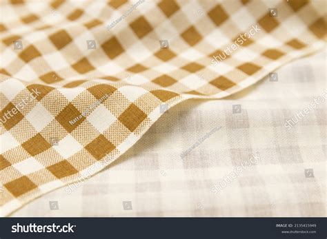 Mauled Goldcolored Plaid Fabric Texture Background Stock Photo