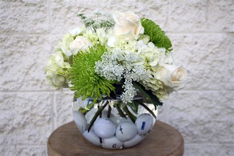 We can help you express just the sentiment to make any occasion special. Golf balls!? Yup! - Four Seasons Flowers Centerpiece ...