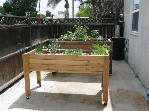 This simple elevated planter box requires common materials and tools, so i don't see any reason you can't do this project in a few hours. Image result for raised planter box with wheels | Portable ...