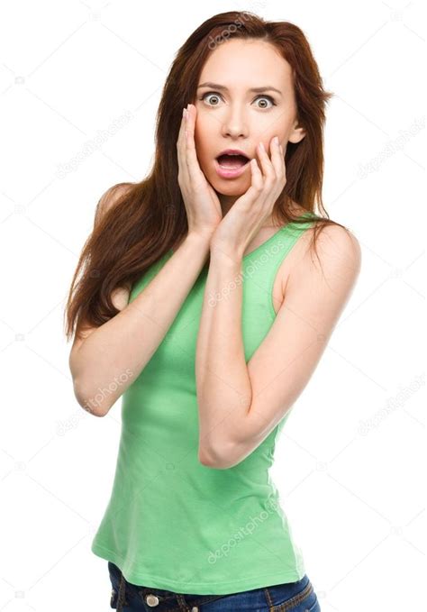 Woman Is Holding Her Face In Astonishment — Stock Photo © Kobyakov