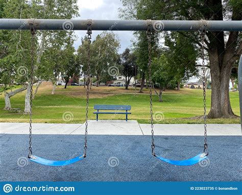Swings At Children Playground Activities In Public Park Stock Image