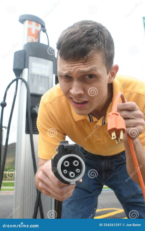 Man Charging His Electric Vehicle Stock Image Image Of Capacity