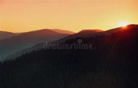 Amazing Landscape Of Mountains At Sunrise View Of Orange Sky And Hills