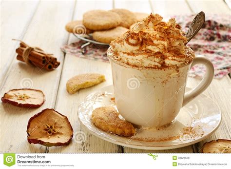 Cup Of Whipped Cream Coffee And Apple Cookies On Wooden