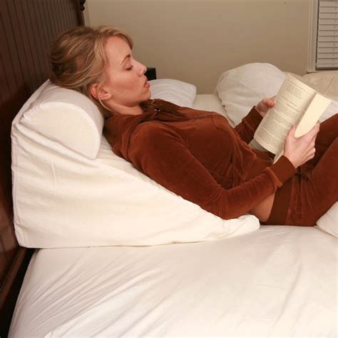 The product's wedge and triangle design provide its users with enough support while leaning back or sitting up on the pillow. Shop Bed Wedge Memory Foam Reading Pillow - Free Shipping Today - Overstock.com - 10736295