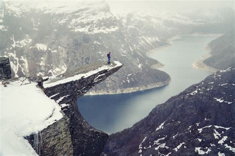 Premium Photo Trolltunga Cliff Under Snow In Norway Scenic Landscape