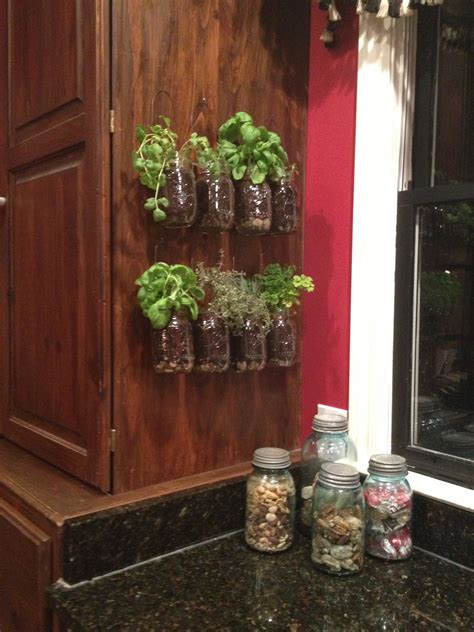 Adding glass shelves between two sets of cabinets in front of the kitchen window is an ideal location for some plants. Kitchen Herb Garden