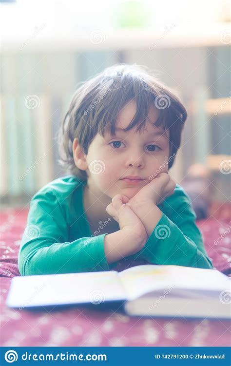 The Child Is Reading A Book Stock Photo Image Of Happy Casual 142791200