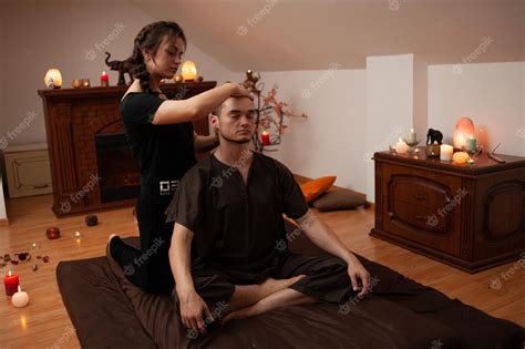 Premium Photo A Woman Is Getting A Massage From A Man In A Room With A Fireplace And A Fireplace