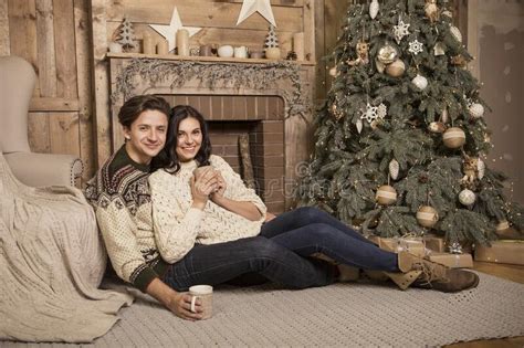 Beautiful Brunette Caucasian Romantic Loving Couple In Cozy Warm Sweaters In The Cabin On A