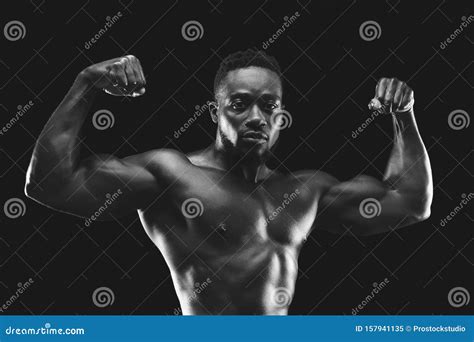 Professional Black Bodybuilder Demonstrating His Amazing Musculs Stock
