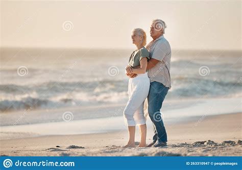 Mature Husband Hugging His Wife On The Beach Senior Couple Being