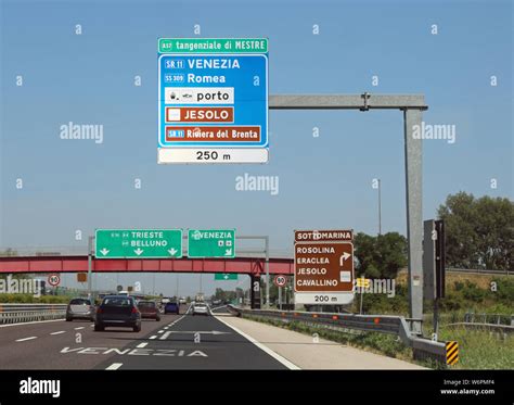 Big Italian Road Signals On The Highway With The Name Of Many Places