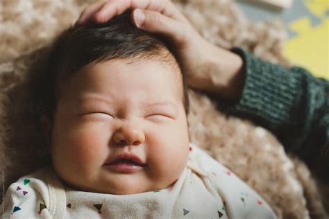 Baby Scrunching Up Face Del Colaborador De Stocksy Lauren Lee Stocksy