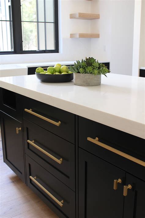 Matte black hardware is also popular in farmhouse and rustic kitchen styles. Rift Sawn Oak Cabinets - Martinique