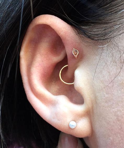 17 Beautiful Ideas For Your Daith Piercing Daith Jewelry Earings Piercings Cool Ear Piercings