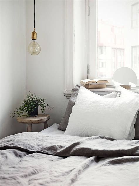 Would you use a small stool as a nightstand? #MinimalistBedroom