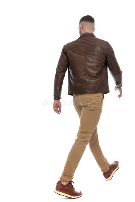 Back View Of Cool Casual Man Looking Away And Walking Stock Image