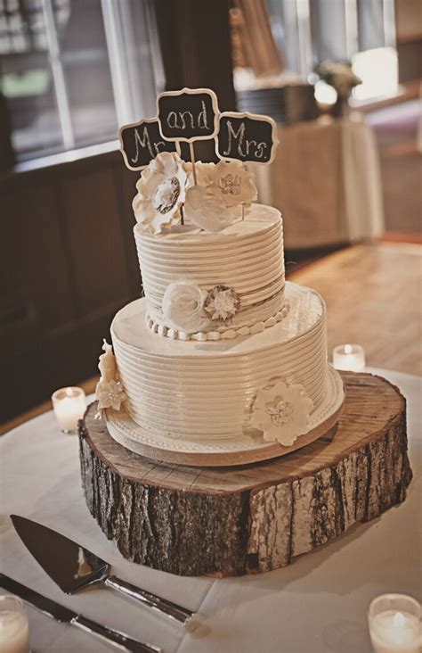 Learn how to make your own wedding cake with this simple tiered wedding cake recipe, which is easier than it looks. Two-Tier White Wedding Cake with Chalkboard Cake Topper on ...