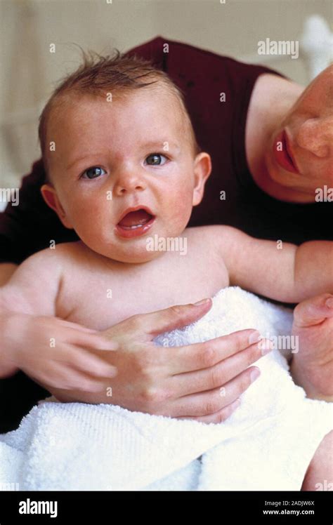 Baby After Bath Mother Drying Off Her Six Month Old Baby Boy After A