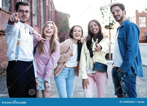Group Of Young People Having Fun Together Outdoors Stock Photo Image